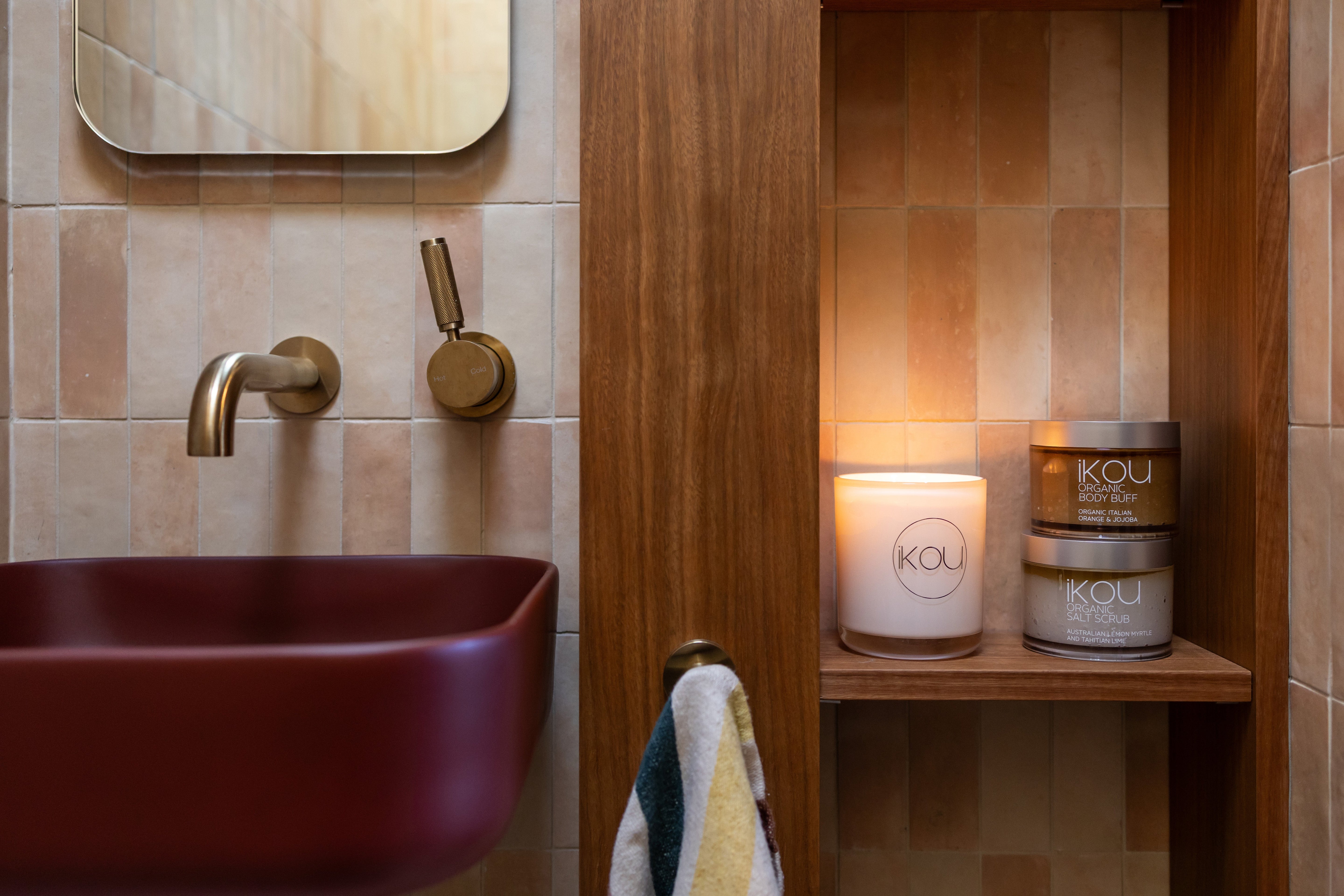 Beautiful bathroom with candle and body scrub 