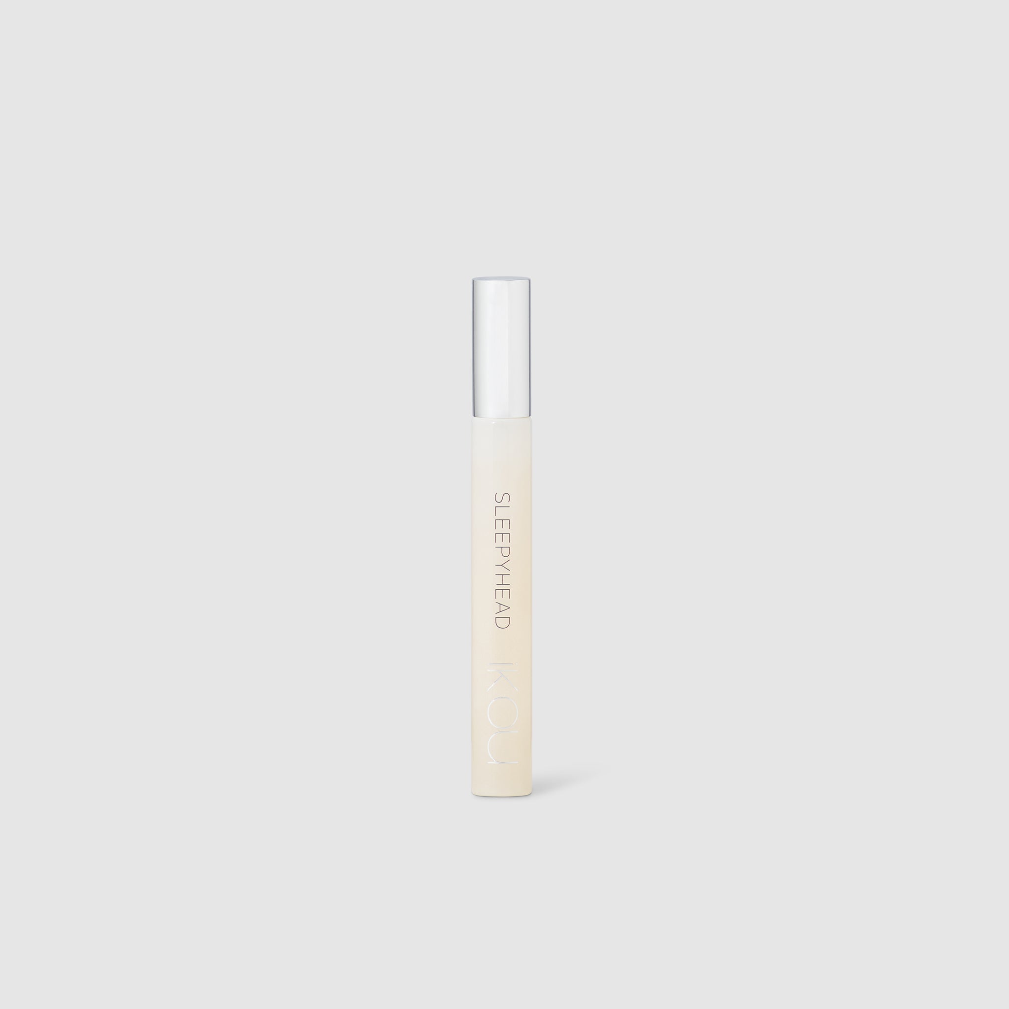 iKOU SleepyHead Aromatherapy roll-on for relaxation, featuring calming botanical ingredients in a portable bath and body product.