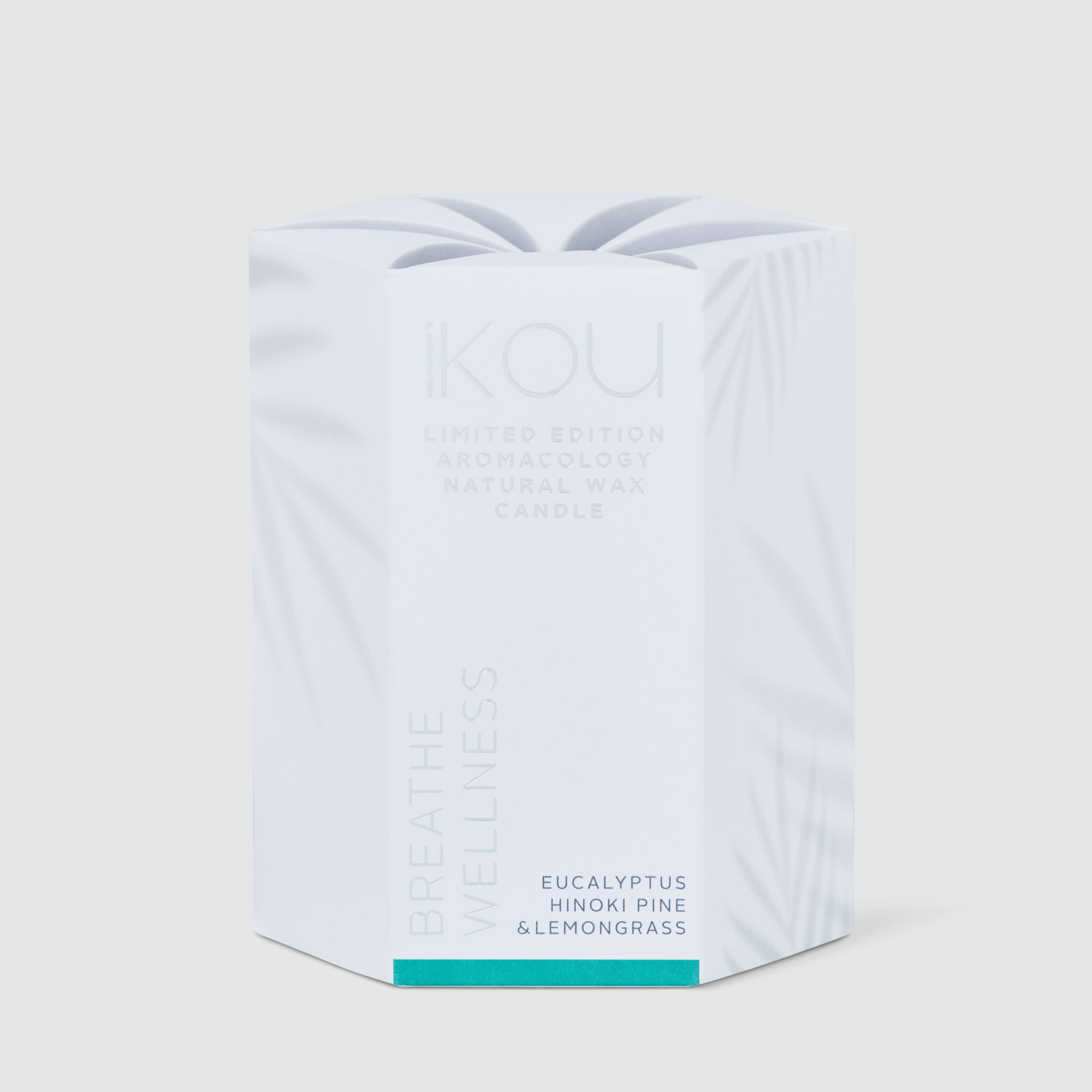 White candle packaging with text on a light gray background