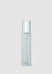 Clear glass bottle with silver cap on a light gray background