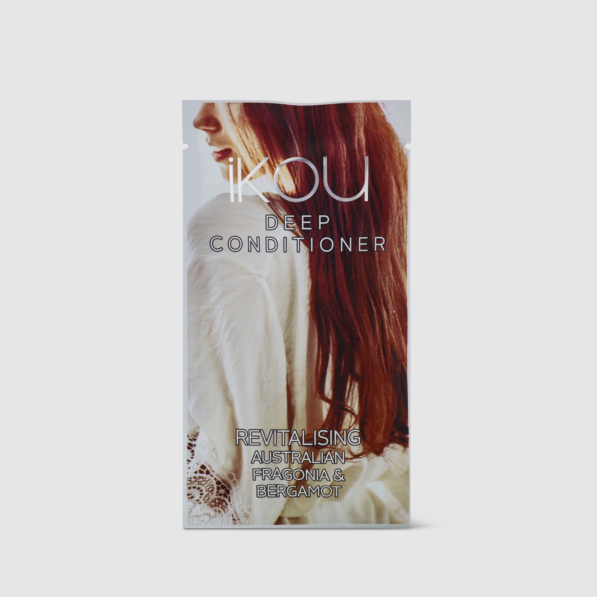 IKOU Deep Conditioner packaging with a woman's face and red hair on a light gray background