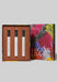 A boxed Roll on fragrance gift set. The set includes three white cylindrical perfume bottles with silver caps arranged in an open rectangular box, alongside the Jenny Kee outer box lid.