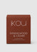 Brown box of 'IKOU' Sandalwood & Cedar candle on a light gray background