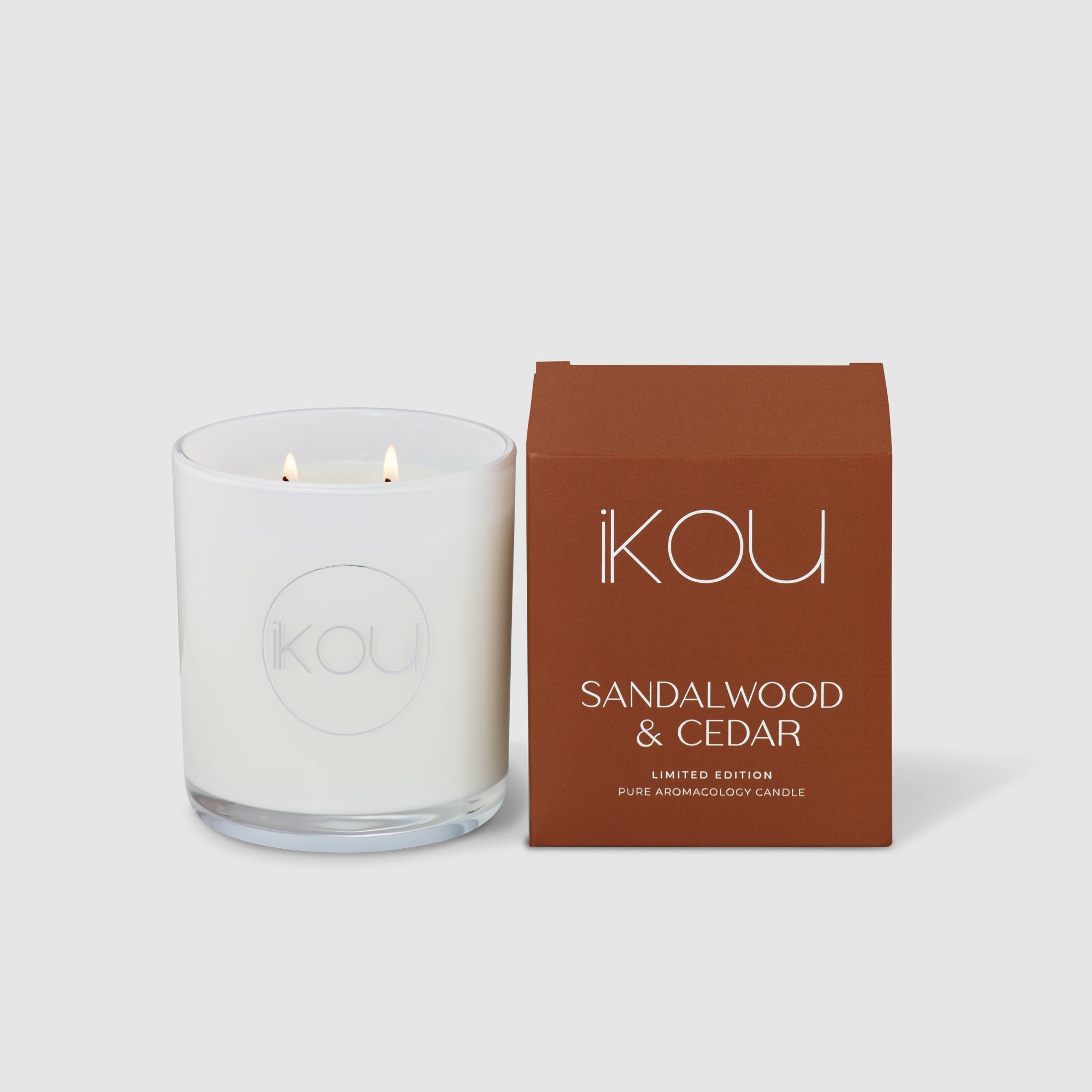 Sandalwood & Cedar candle with packaging on a white background