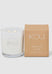 White candle with 'IKOU' branding next to a brown box labeled 'Vanilla Chai' on a white background