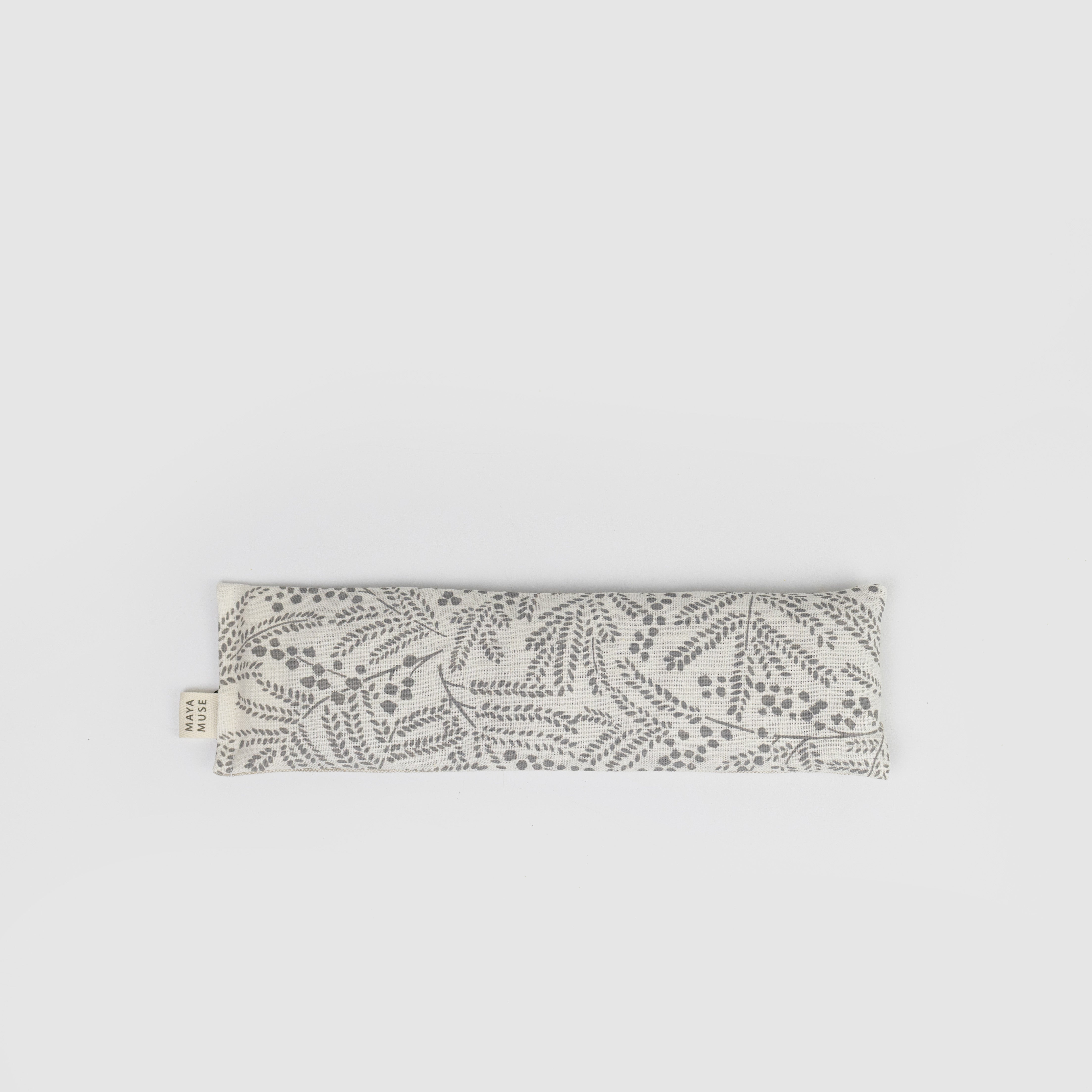 Patterned eye pillow on a light grey background