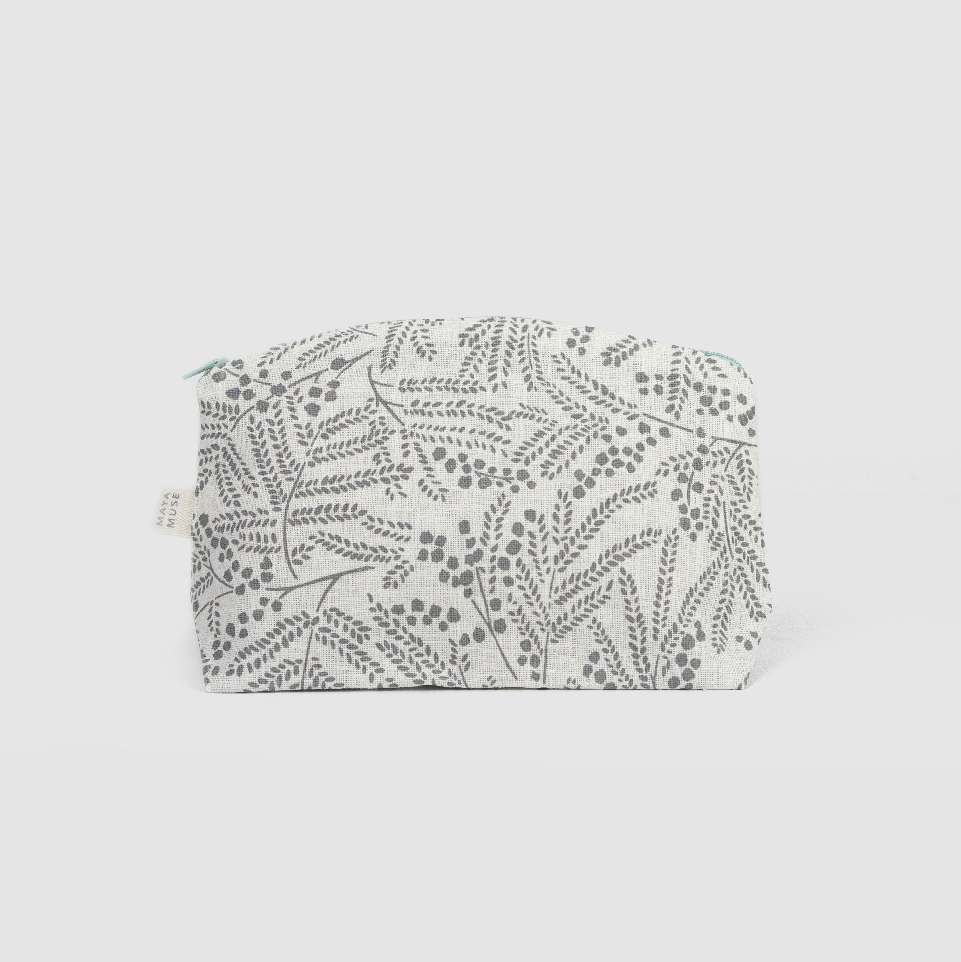 Floral patterned pouch on a light grey background