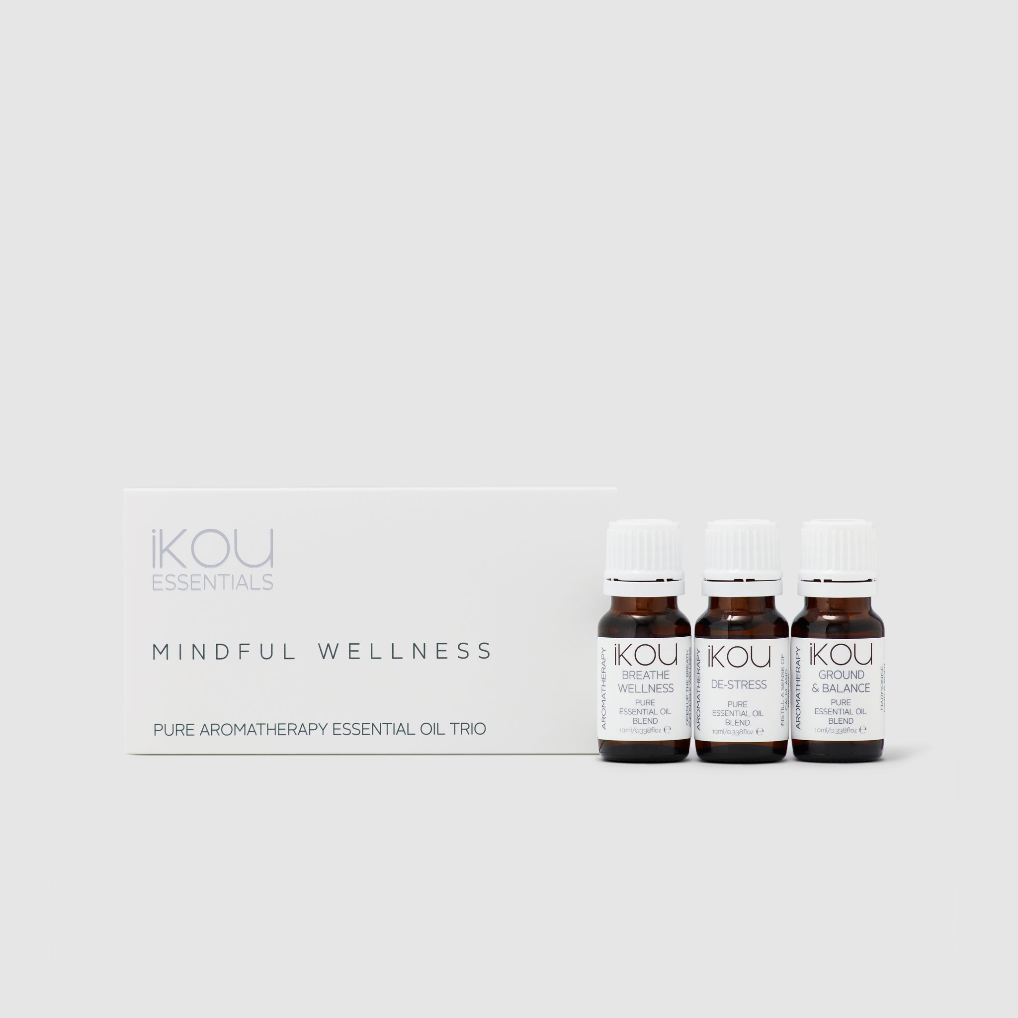 Three essential oil bottles with labels on a white background, featuring the brand 'IKOU'.