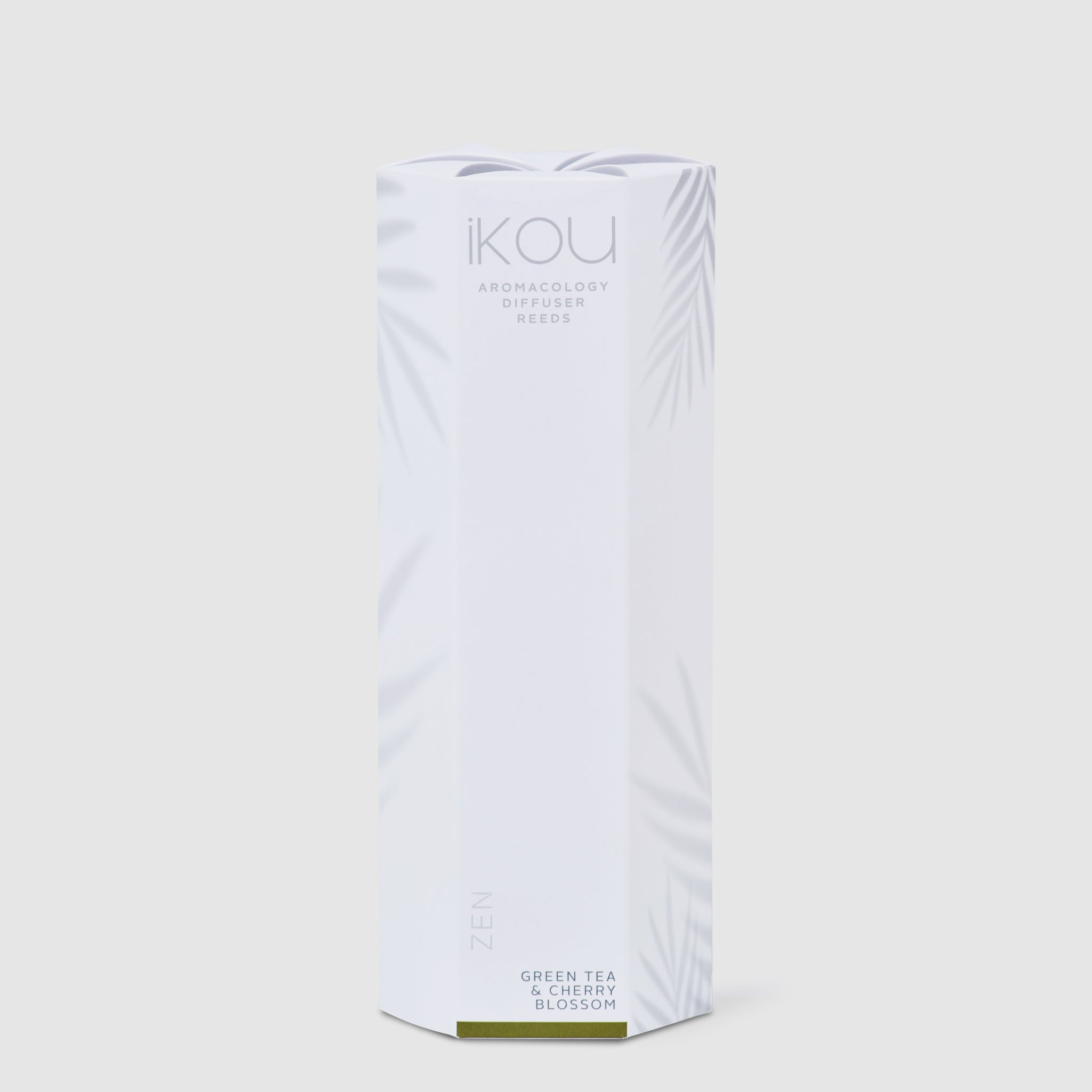White tea packaging with 'IKOU' branding on a light gray background