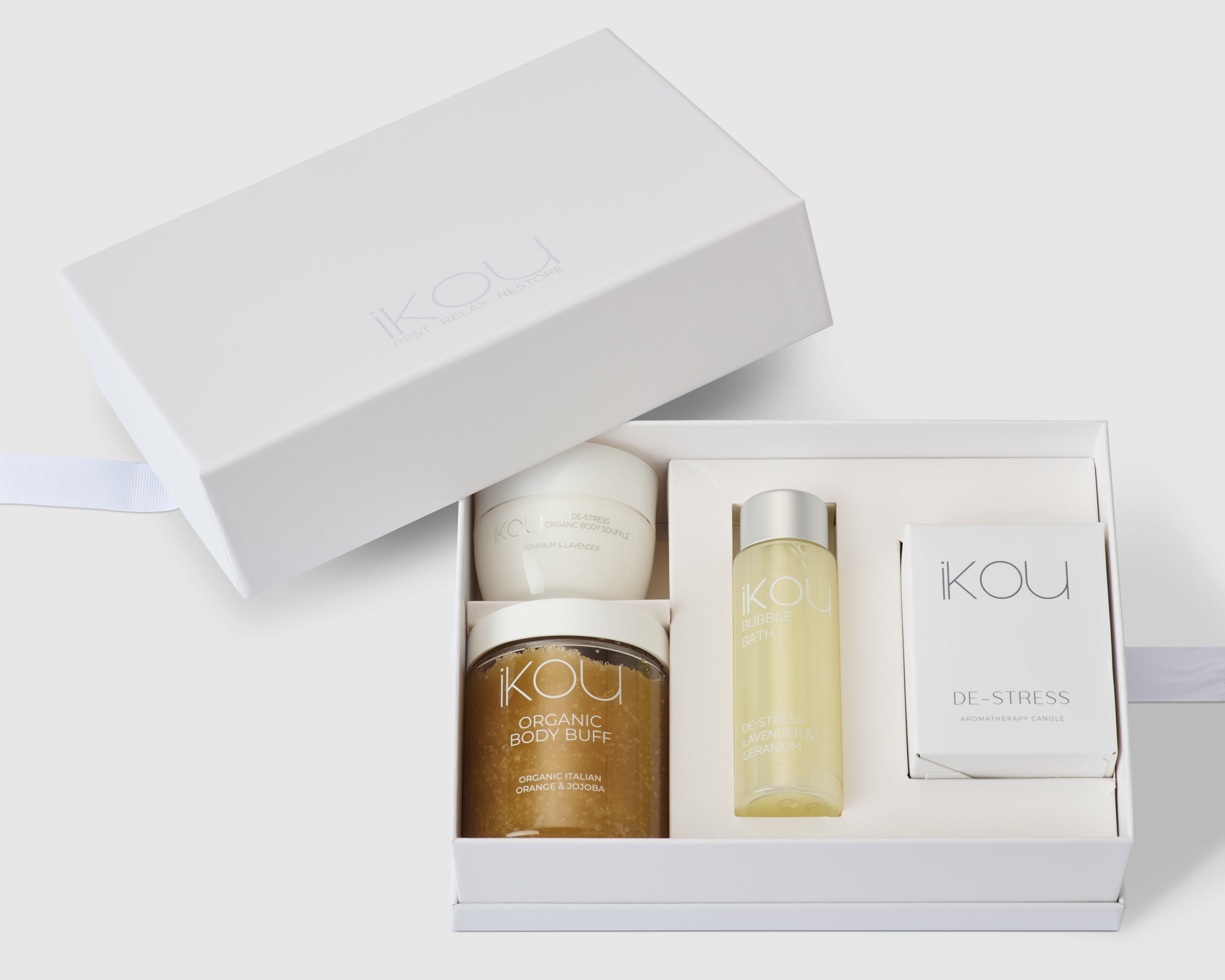 IKOU De-Stress & Restore Bath Ritual gift pack with spa essentials including bath salts, oils, and relaxing accessories.