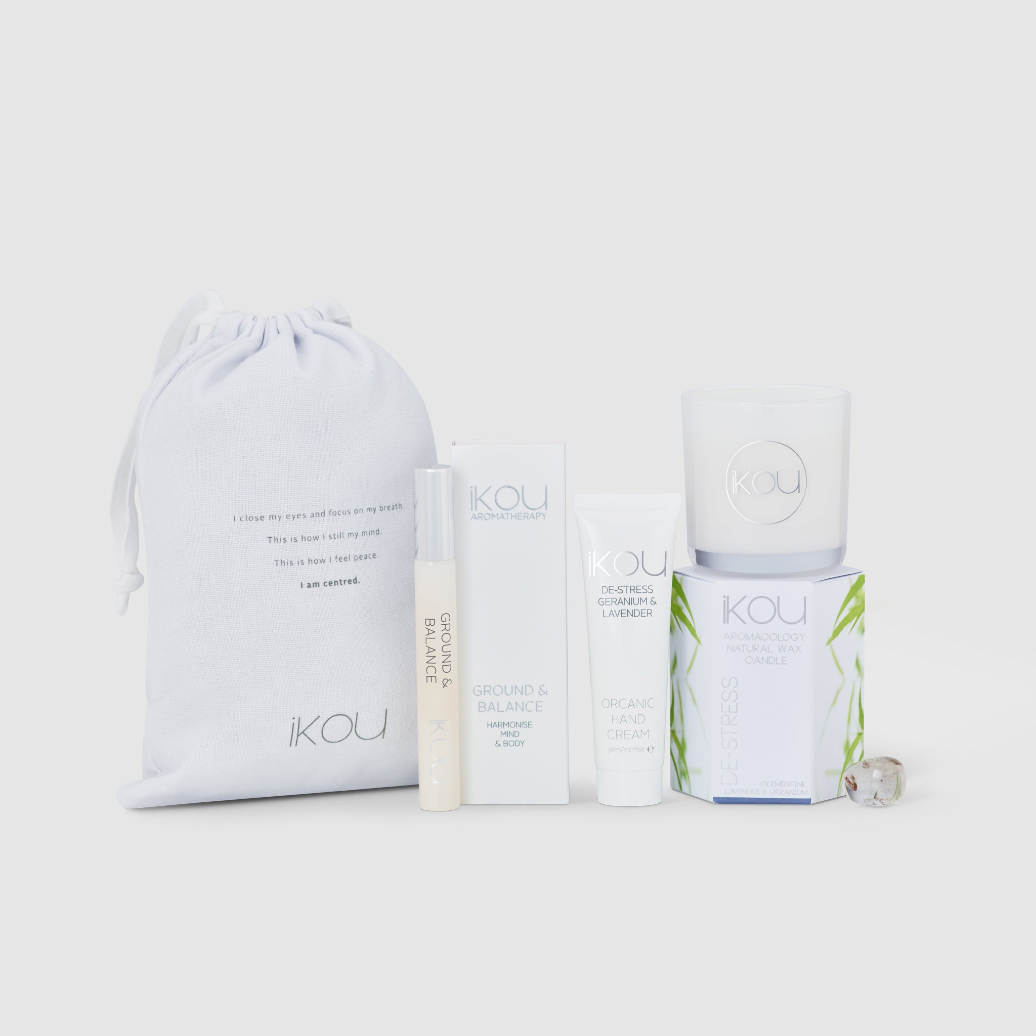 Set of products with 'IKOU' branding on a light grey background