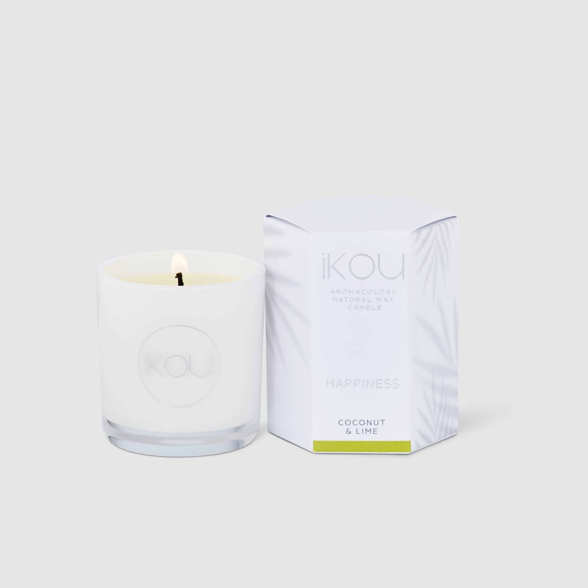 Candle with packaging labeled 'IKOU' on a white background