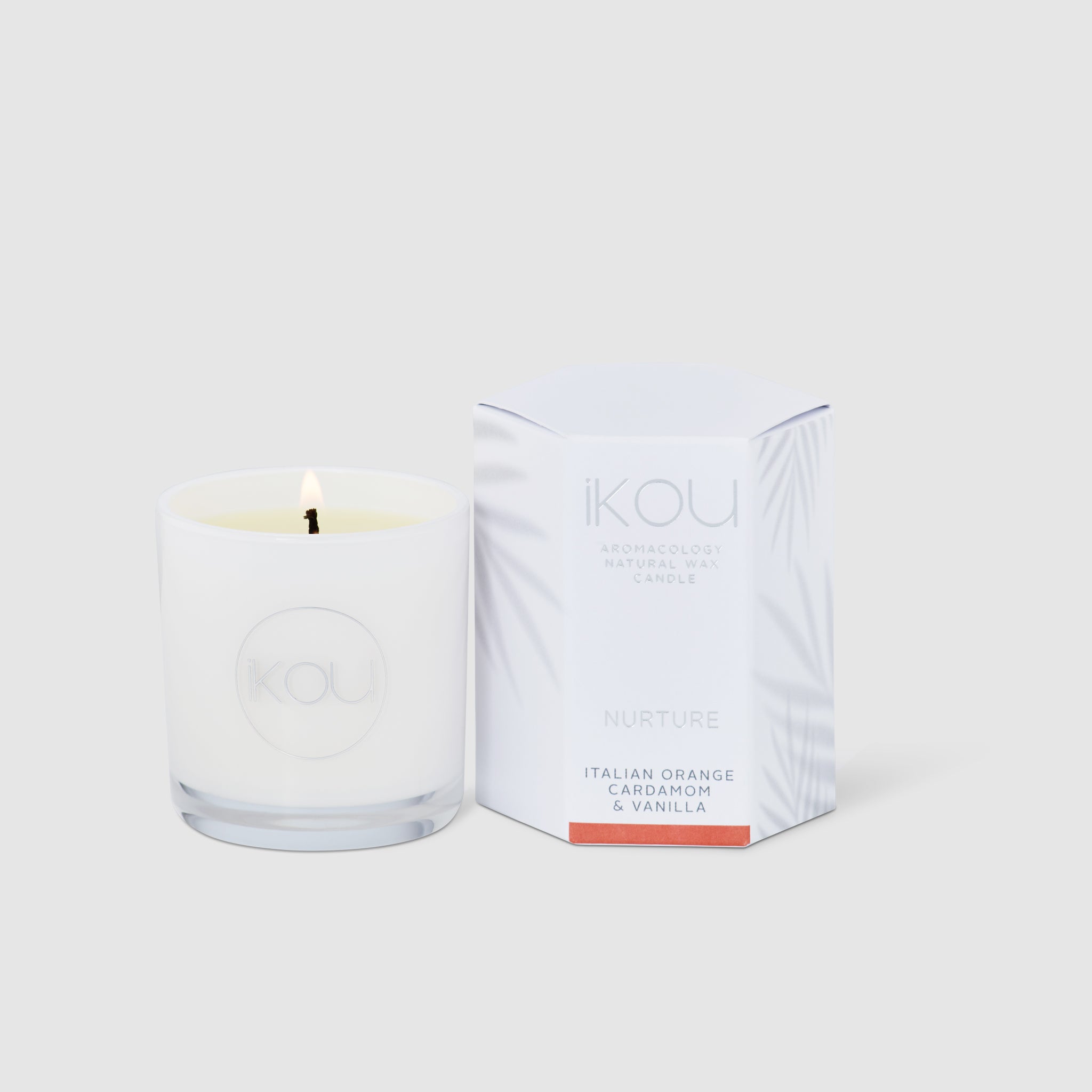 Candle with packaging labeled 'IKOU' on a white background