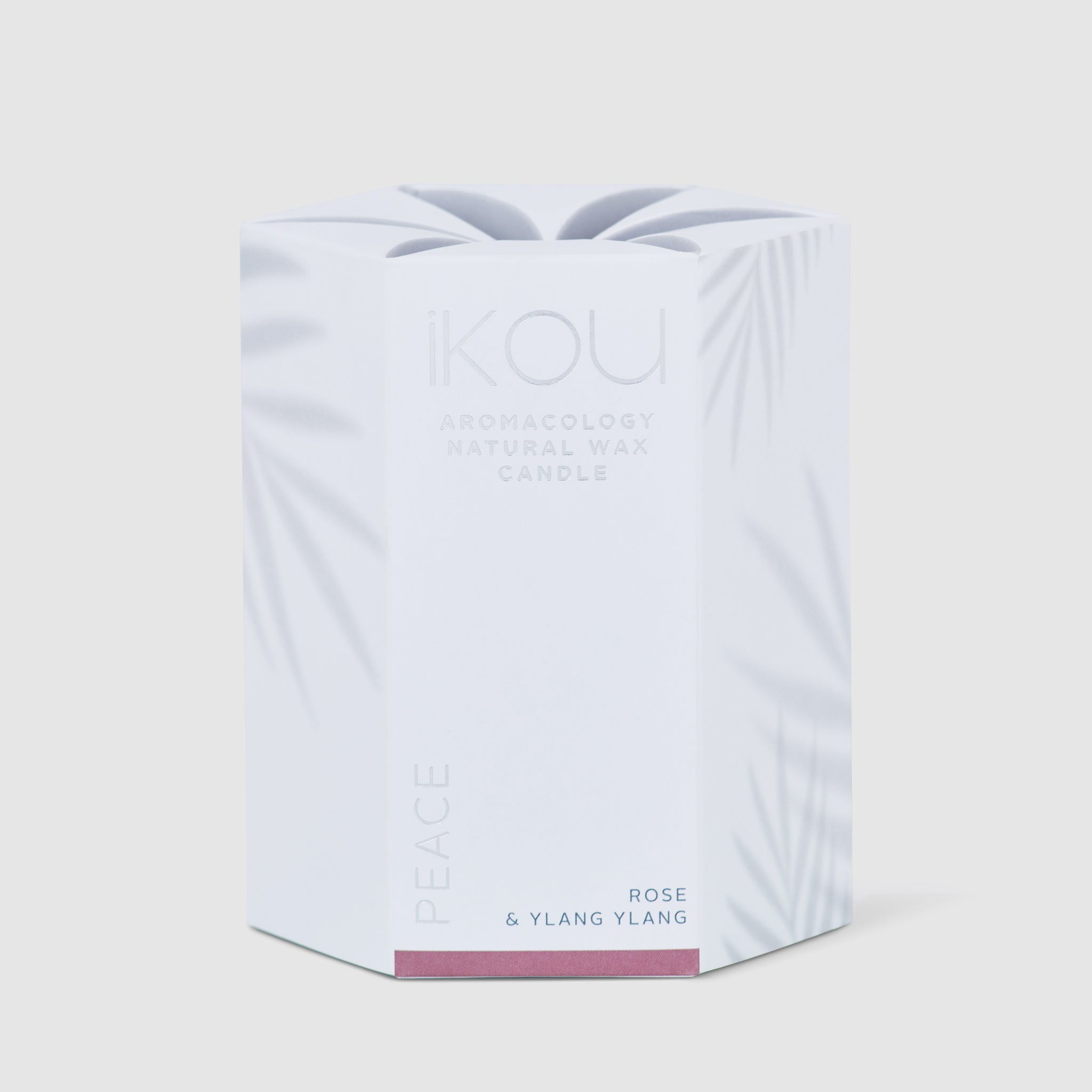 Candle packaging with 'KOU' branding on a light gray background