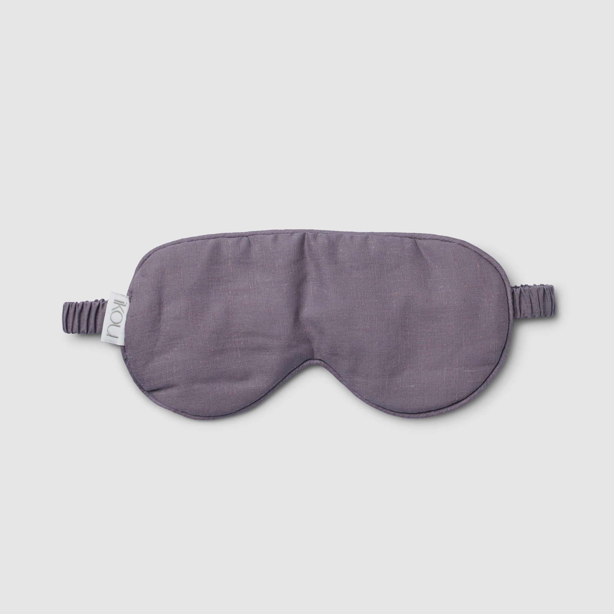 Gray sleep mask on a light gray background