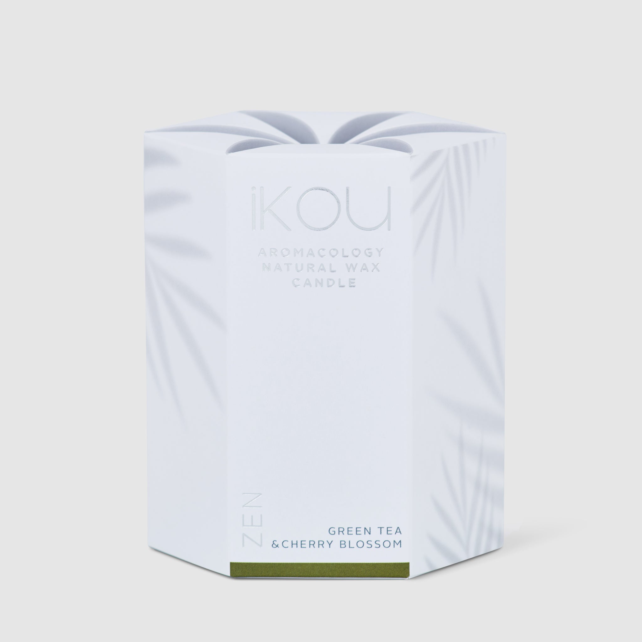 KOU candle packaging with 'Green Tea & Cherry Blossom' text on a light gray background